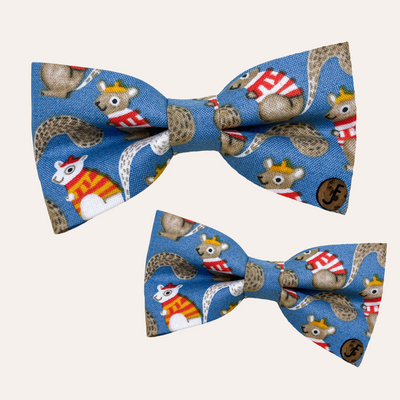 Blue bow ties with tan and white squirrel pattern with the squirrels in sweaters and berets
