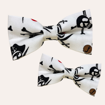 Cream bow ties with black and red pirate jolly rogers or skull and crossbones 