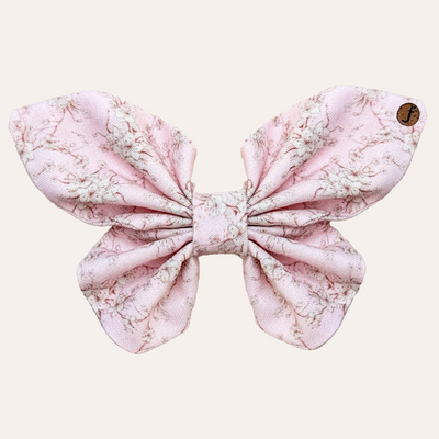 Light pink butterfly shaped bow tie with white and mahogany brown floral pattern for dog and cat collars