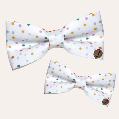 White bows with colorful dots