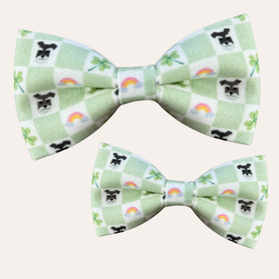 Green and cream check pattern dog bow tie with pattern of rainbows, clovers and schnauzer faces