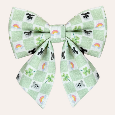 Green and cream check pattern sailor bow with pattern of rainbows, clovers and schnauzer faces