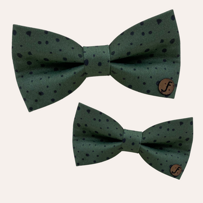 Dark green bow with black spots pattern