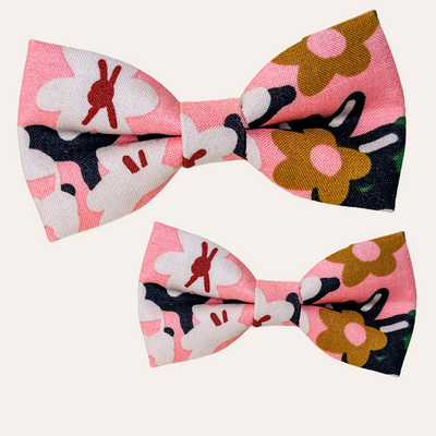 Coral neon bow tie for dog collar with floral pattern of gold and cream