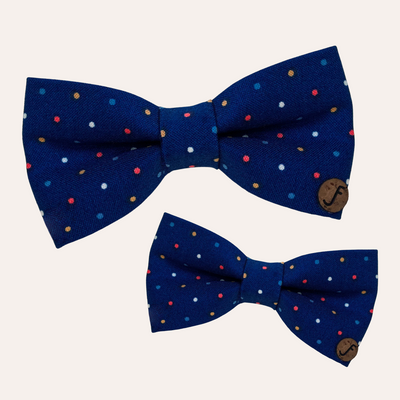 Navy blue bows with colorful dots in red, white, and gold