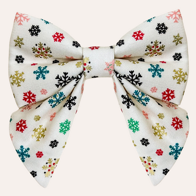 Cream sailor bow with multi color snowflake print including metallic gold