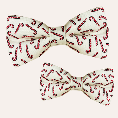 Cream bow ties with hand drawn candy cane pattern for cats and dogs