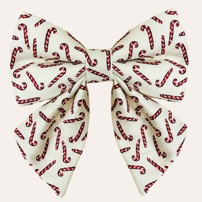 Cream sailor bow with hand drawn candy cane pattern for cats and dogs