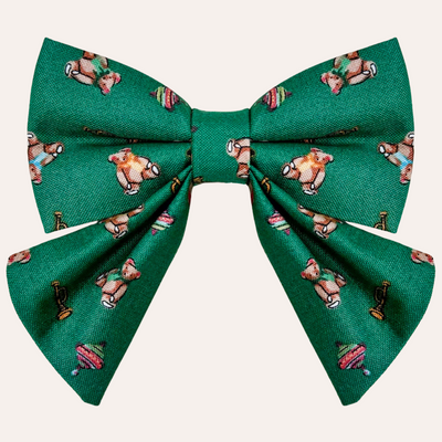 Green sailor bow with vintage toy pattern, primarily teddy bears, tops, and trumpets