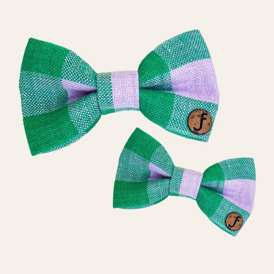 Two bows in a green and lilac gingham plaid check