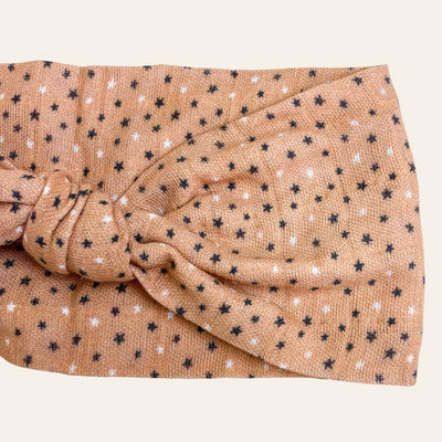 Tan knotted scarf with black and white star print