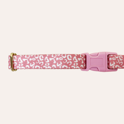 Dog collar in dark pink with white leopard spots, gold hardware and light pink plastic buckle