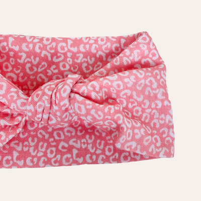 Coral pink knotted scarf with white leopard print