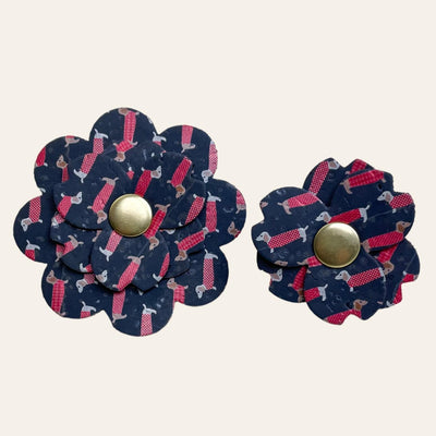 Navy blue cork flower with pattern of brown doxie dogs in red sweaters