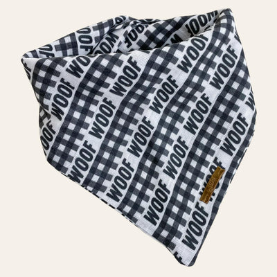 Bandana in black and white with gingham stripes and the graphic text "woof"