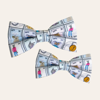 Pastel rainbow colored stamps of stylish dogs and cats printed on bow ties