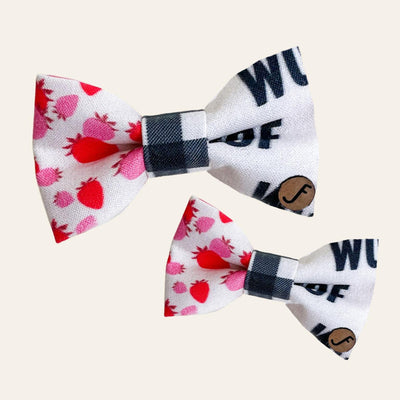 Bow tie with pink and red strawberries, a gingham middle and black and white "woof" graphic print