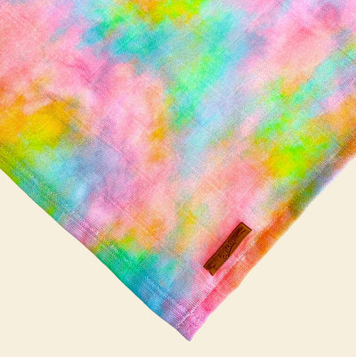 Corner of a pastel rainbow tie dye bandana