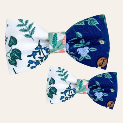 Blue and white bow ties with green and blue floral print.