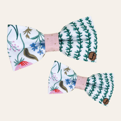 White bow ties with pink, green, blue floral and vine print