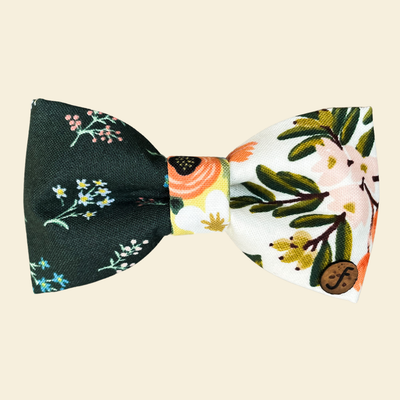 Dark green and white bow with oranges and floral motifs