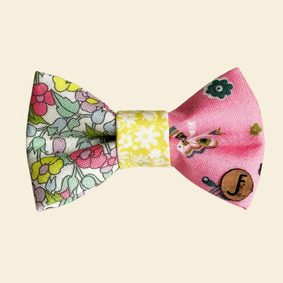 Pet bow tie in pastel floral and butterfly print fabrics, mostly pink, yellow and white in color